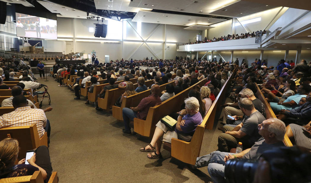 In this June 18, 2019 file photo people attend a community meeting in Phoenix. Still stinging f ...