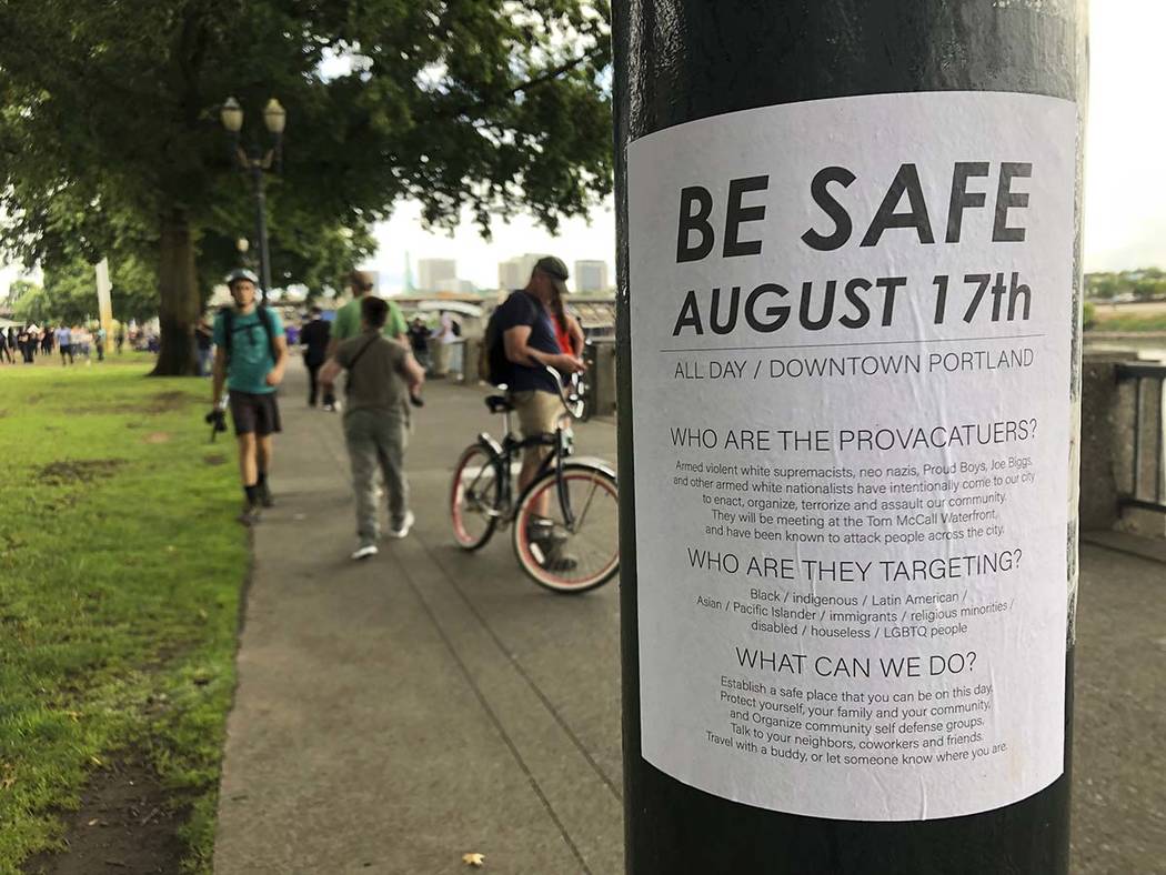 A posted sign reads "Be Safe. August 17th" is posted in Portland, Ore., Saturday, Aug ...