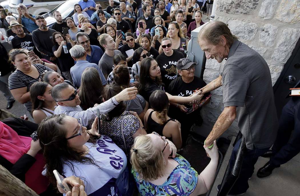 Antonio Basco greets some of the hundreds in line to attend his longtime companion Margie Recka ...