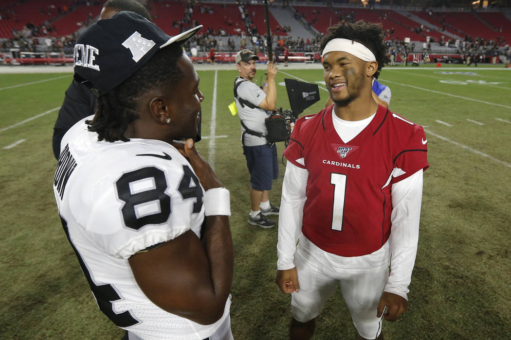 Oakland Raiders receiver Antonio Brown (84) and Arizona Cardinals quarterback Kyler Murray (1) ...