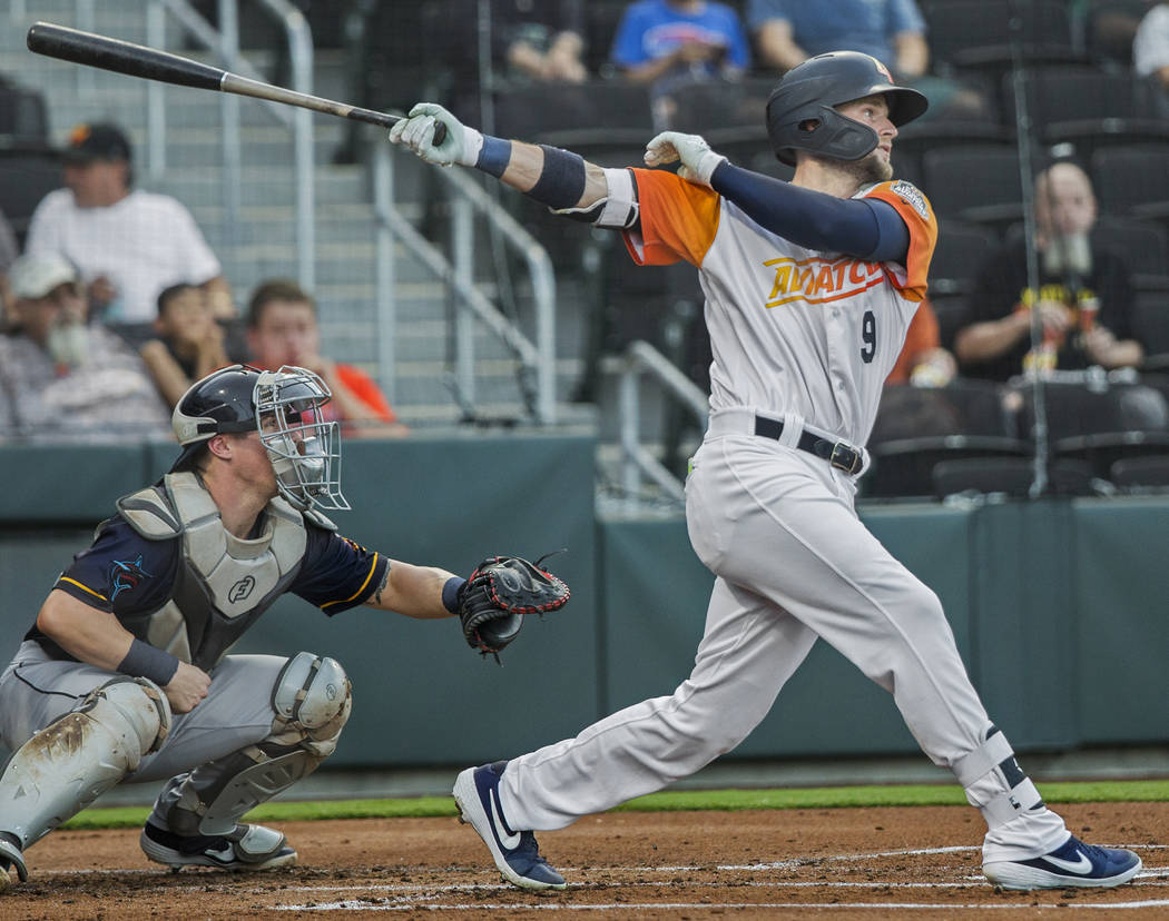 Las Vegas Aviators first baseman Seth Brown (9) hits a single in the bottom of the first inning ...