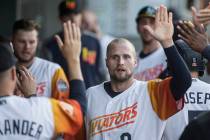 Las Vegas Aviators first baseman Seth Brown (9) high fives his teammates after scoring in the b ...