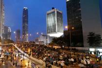 Protesters march in the rain in Hong Kong Sunday, Aug. 18, 2019. Heavy rain fell on tens of tho ...