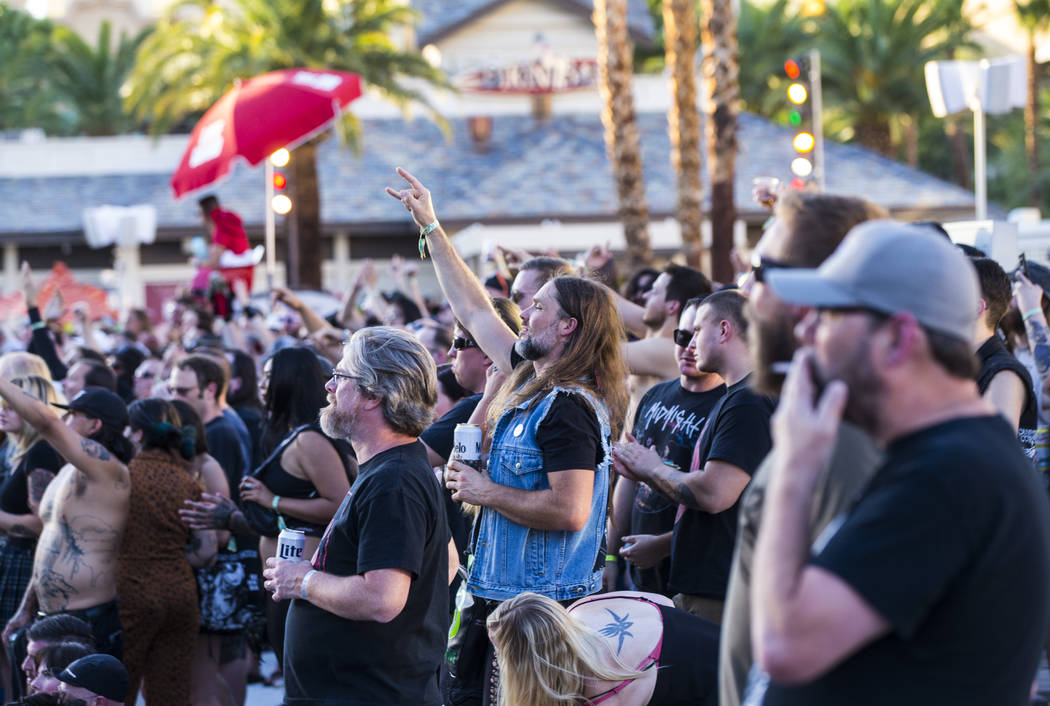 Metal fans cheer as Yob performs at the beach stage during the Psycho Las Vegas music festival ...