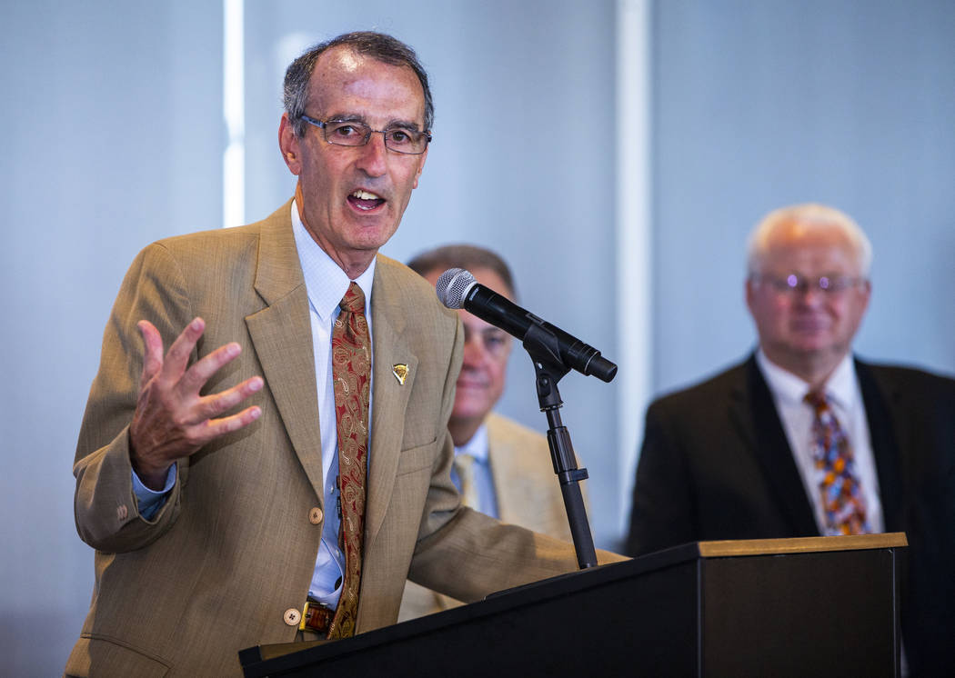 International League President Randy Mobley, left, speaks during a press conference announcing ...