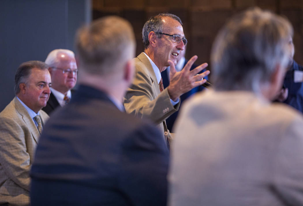 International League President Randy Mobley, center, speaks during a press conference announcin ...