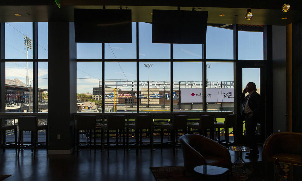 Pacific Coast League President Branch Rickey takes a call at the Las Vegas Ballpark before anno ...