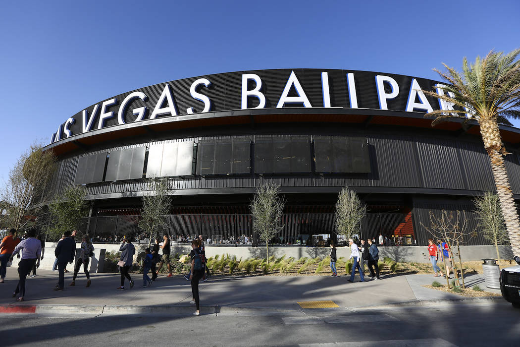 Fans line up to enter the Las Vegas Ballpark for the Las Vegas Aviators' home opener in Downtow ...