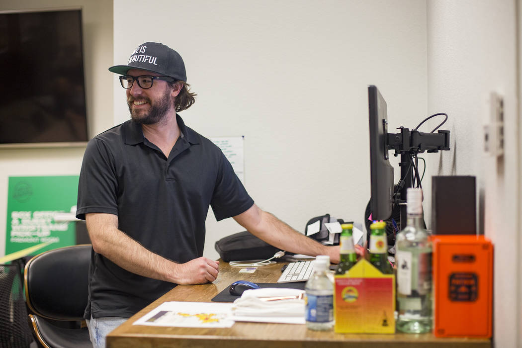 Lee Flint, the culinary director for Life Is Beautiful Festival, works at his desk at the Life ...