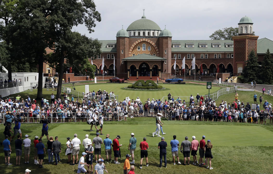 Justin Thomas and Tony Finau walk to the first hole fairway during the final round of the BMW C ...