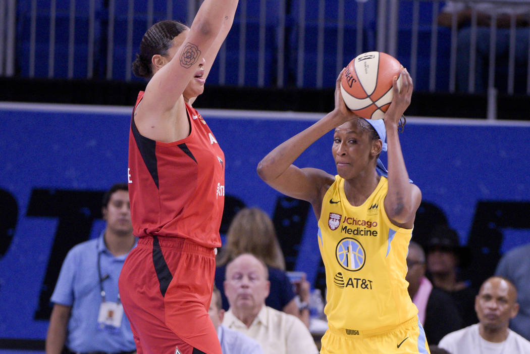 Las Vegas Aces' Liz Cambage keeps the pressure on Chicago Sky's Astou Ndour during the first ha ...