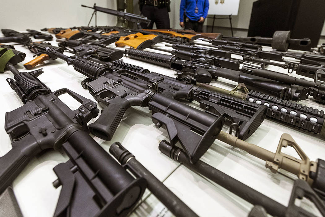 In this Dec. 27, 2012, file photo, a variety of military-style semi-automatic rifles obtained d ...