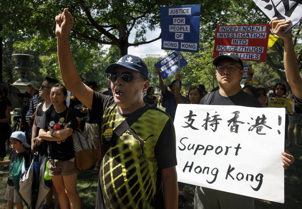 People gather in Lafayette Square in front of the White House in Washington, Sunday, Aug. 18, 2 ...