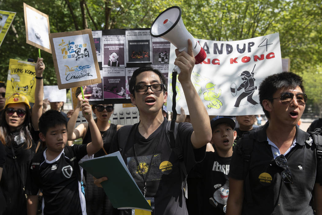 People gather in Lafayette Square in front of the White House in Washington, Sunday, Aug. 18, 2 ...