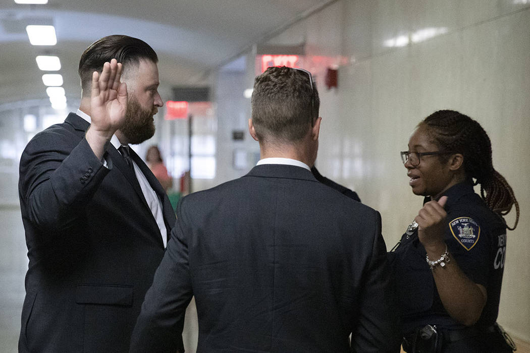 John Kinsman, left, and Maxwell Hare, center, talk with a court officer, Wednesday, July 31, 20 ...