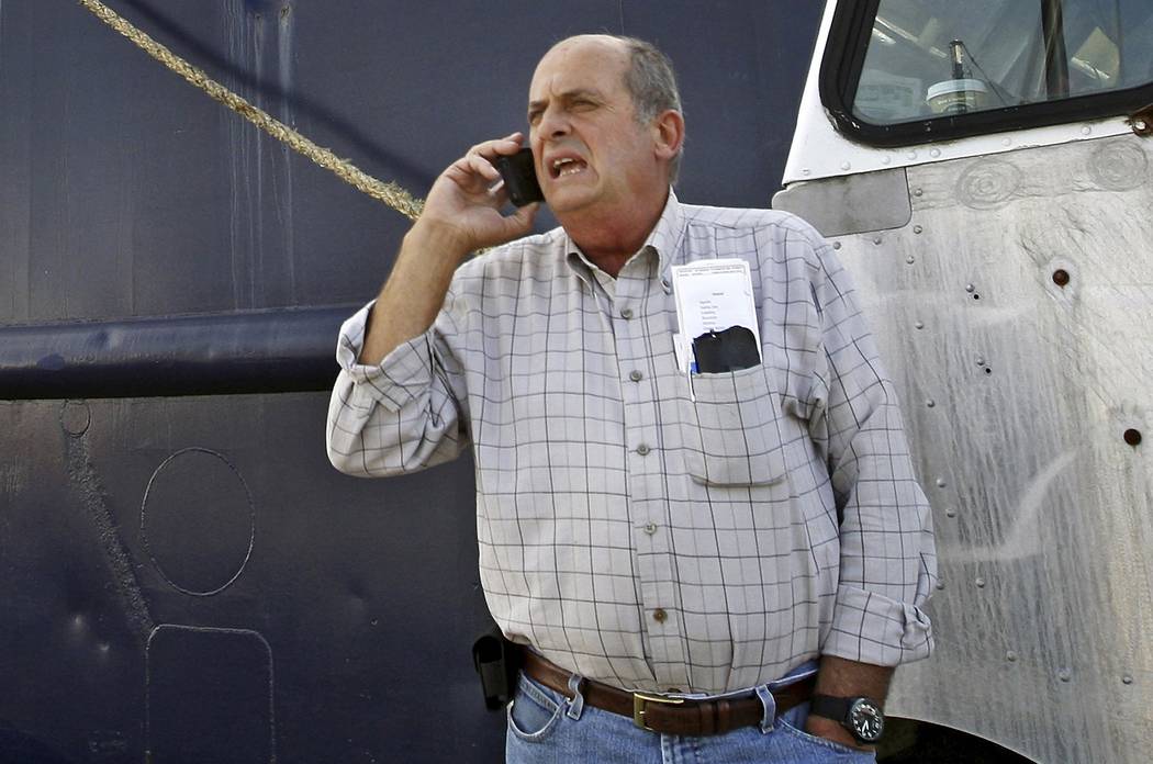 FILE - In this Oct. 14, 2014, file photo, Carlos Rafael talks on the phone at Homer's Wharf nea ...