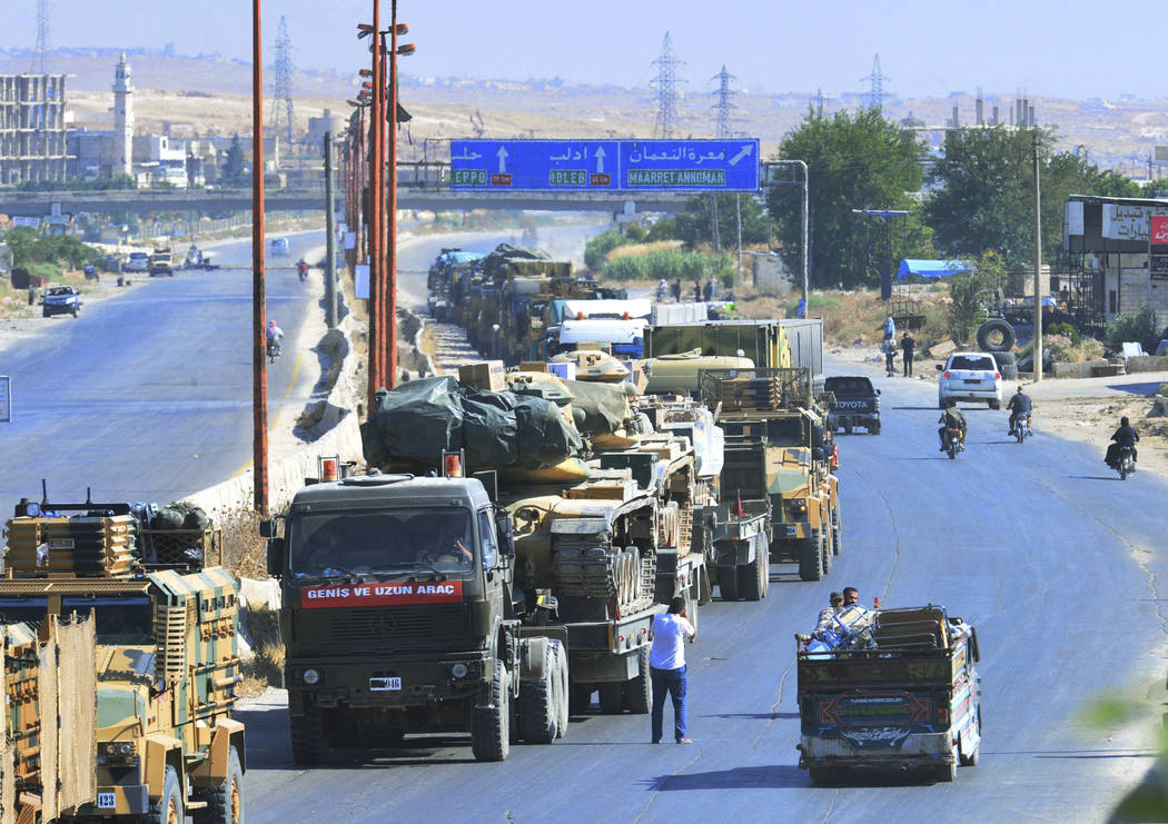 A Turkey Armed Forces convoy is seen at a highway between Maaret al-Numan and Khan Sheikhoun in ...