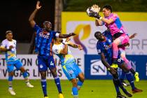 (From right) Las Vegas Lights FC goalkeeper Thomas Olsen (1) grabs a shot on goal over Tulsa Ro ...