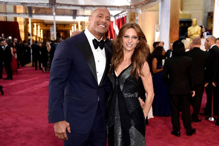 FILE - In this Feb. 22, 2015, file photo Dwayne Johnson, left, and Lauren Hashian arrive at the ...