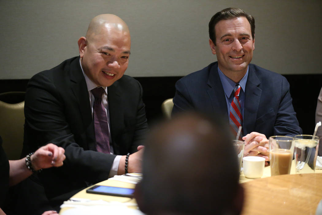 Sonny Vinuya, left, president for the Asian Chamber of Commerce, with former Nevada Attorney Ge ...