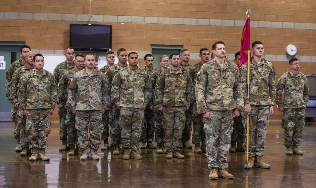 Soldiers with the Nevada Army Guard 3665th Explosive Ordnance Disposal Company stand at attenti ...