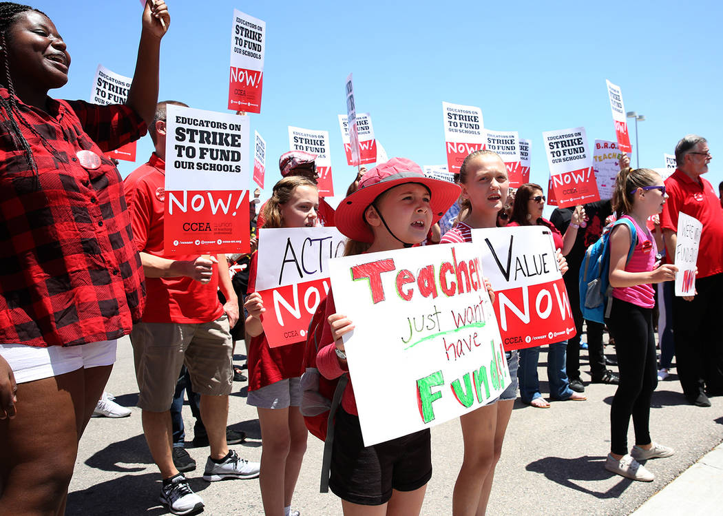 Members and supporters of the Clark County Education Association protest in front of Durango Hi ...