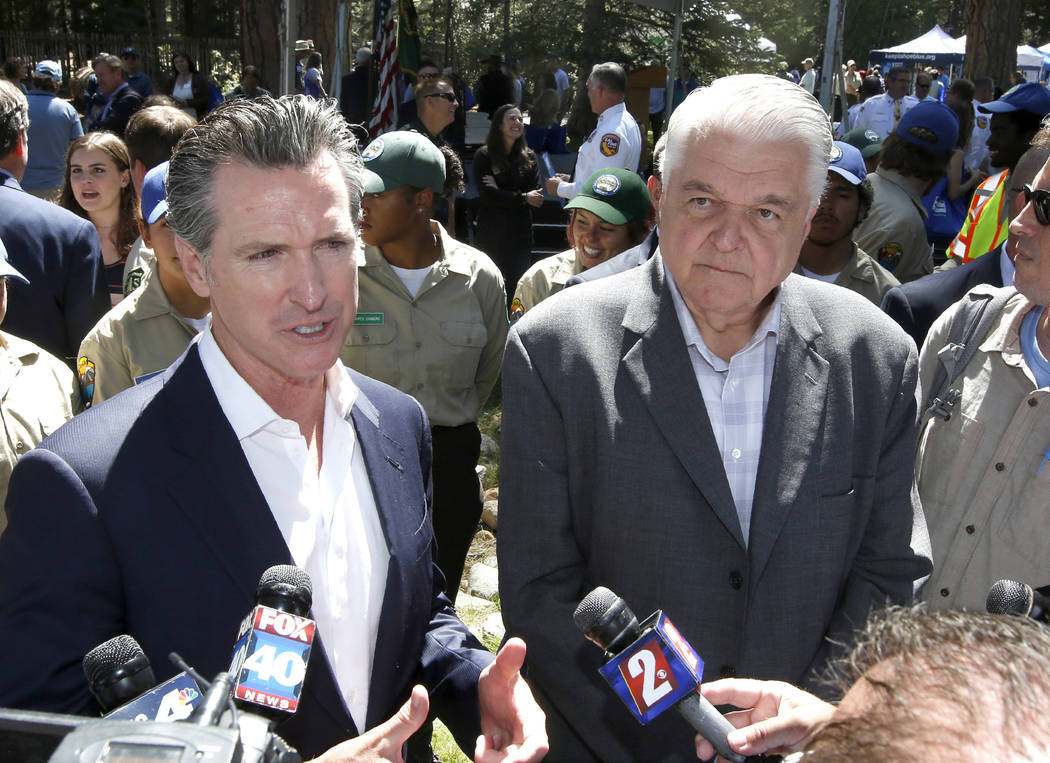 Calif. Gov. Gavin Newsom, left, and Nevada Gov. Steve Sisolak talk with reporters after the 23r ...