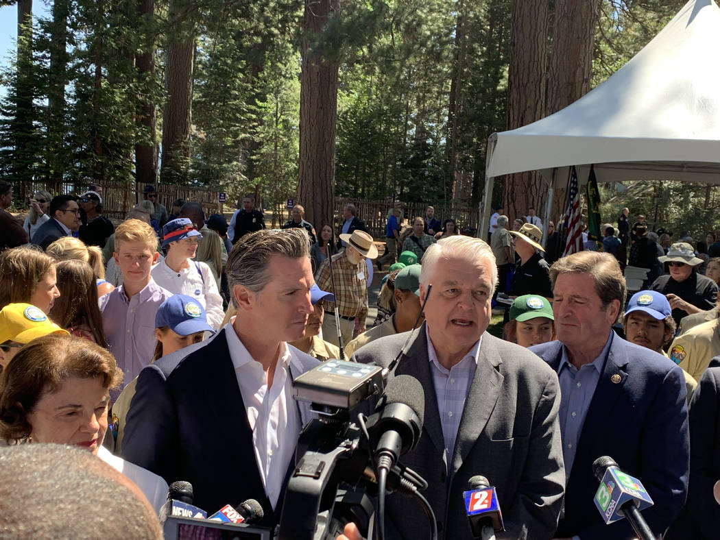 Govs. Gavin Newsom of California, left, and Steve Sisolak of Nevada speak to reporters followin ...