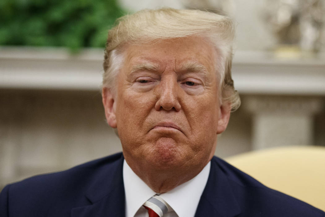 President Donald Trump pauses while speaking during a meeting with Romanian President Klaus Ioh ...