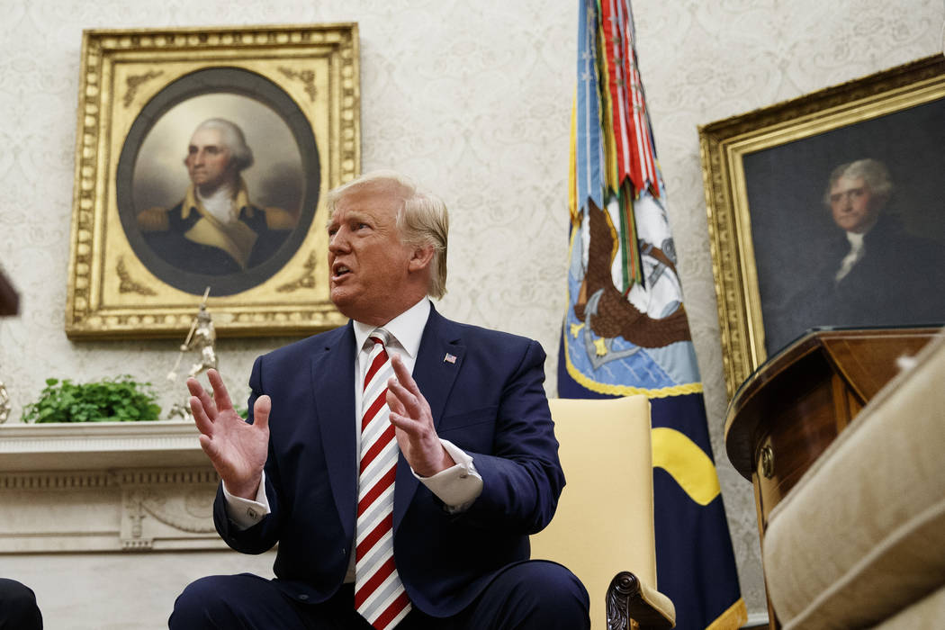 President Donald Trump speaks during a meeting with Romanian President Klaus Iohannis in the Ov ...