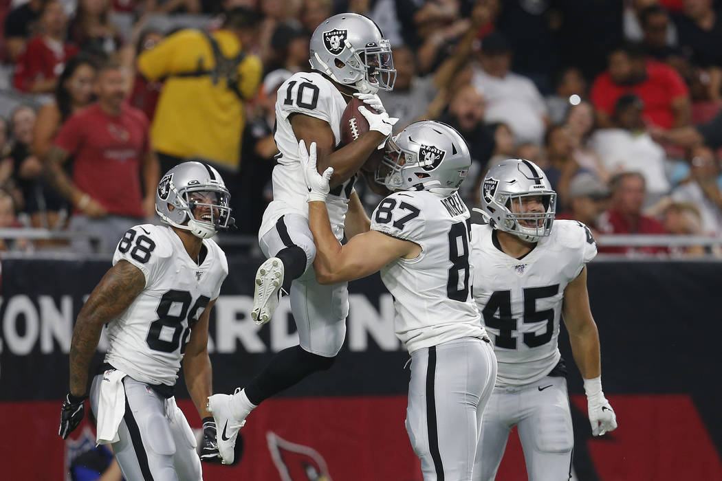 Oakland Raiders wide receiver Rico Gafford (10) celebrates his touchdown against the Arizona Ca ...