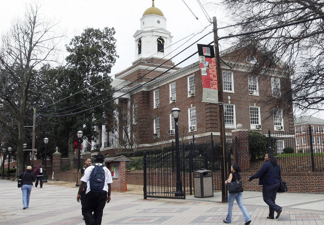 FILE - In this Feb. 12, 2009 file photo, people make their way on the Clark Atlanta University ...