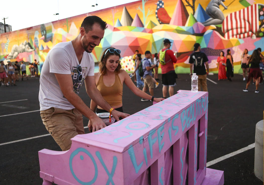 Jordan Maxwell, left, of Las Vegas plays the piano as Aleks Bolta, also of Las Vegas, looks on ...