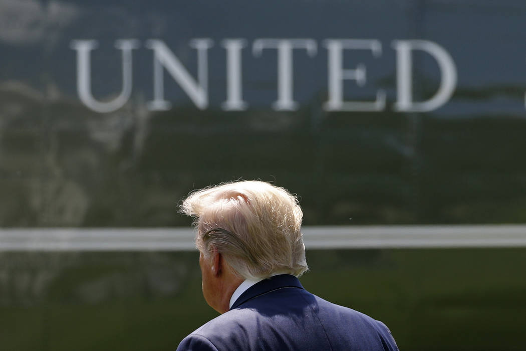 President Donald Trump walks to Marine One after speaking with reporters on the South Lawn of t ...