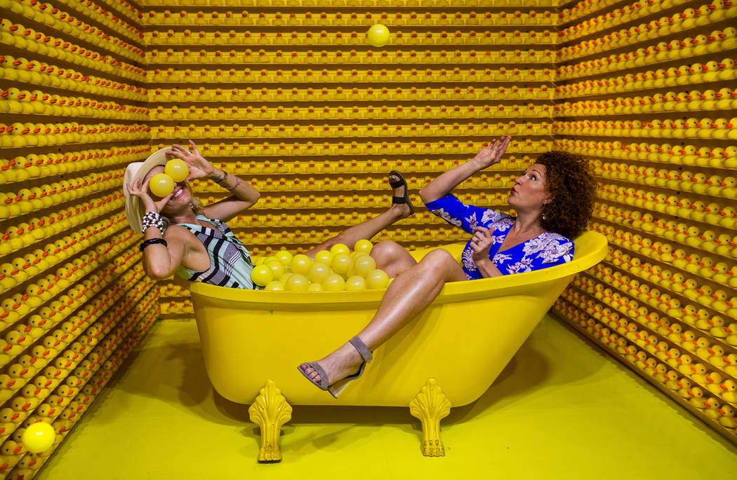 Vanessa Esparza, left, and Tevis Holboron play around in the Bathtub of Fun at the new Happy Pl ...