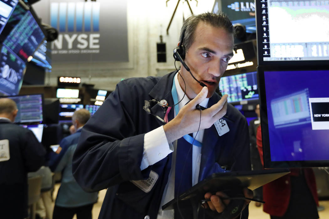 Trader Gregory Rowe works on the floor of the New York Stock Exchange, Wednesday, Aug. 21, 2019 ...