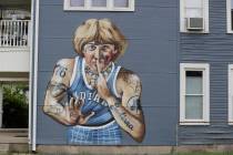 A mural of former NBA star Larry Bird is seen on the side of a multi-family residence in Founta ...