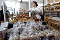 FILE - In this June 20, 2018 file photo, Audrey Wright waits on a customer at Zak the Baker in ...