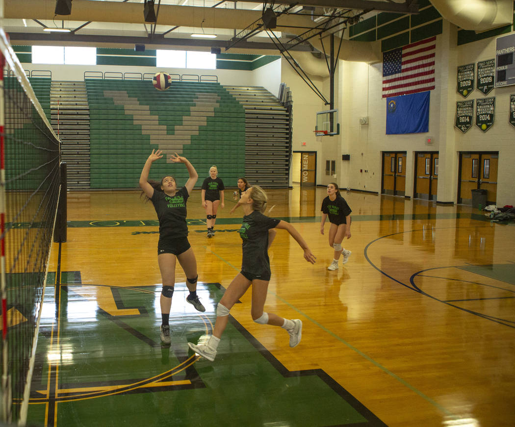 Team captain Arien Fafard, 17, senior, center, prepares to spike the ball during practice at Pa ...