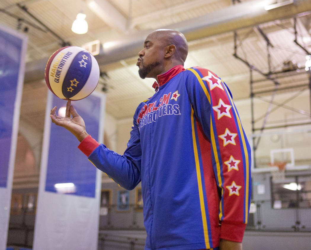 Las Vegas resident and Harlem Globetrotter Scooter Christensen demonstrates tricks at the Dula ...