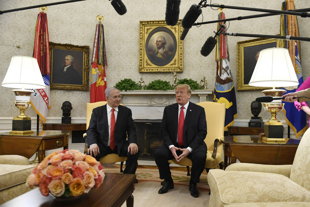 FILE - In this March 25, 2019, file photo, President Donald Trump, right, speaks as Israeli Pri ...