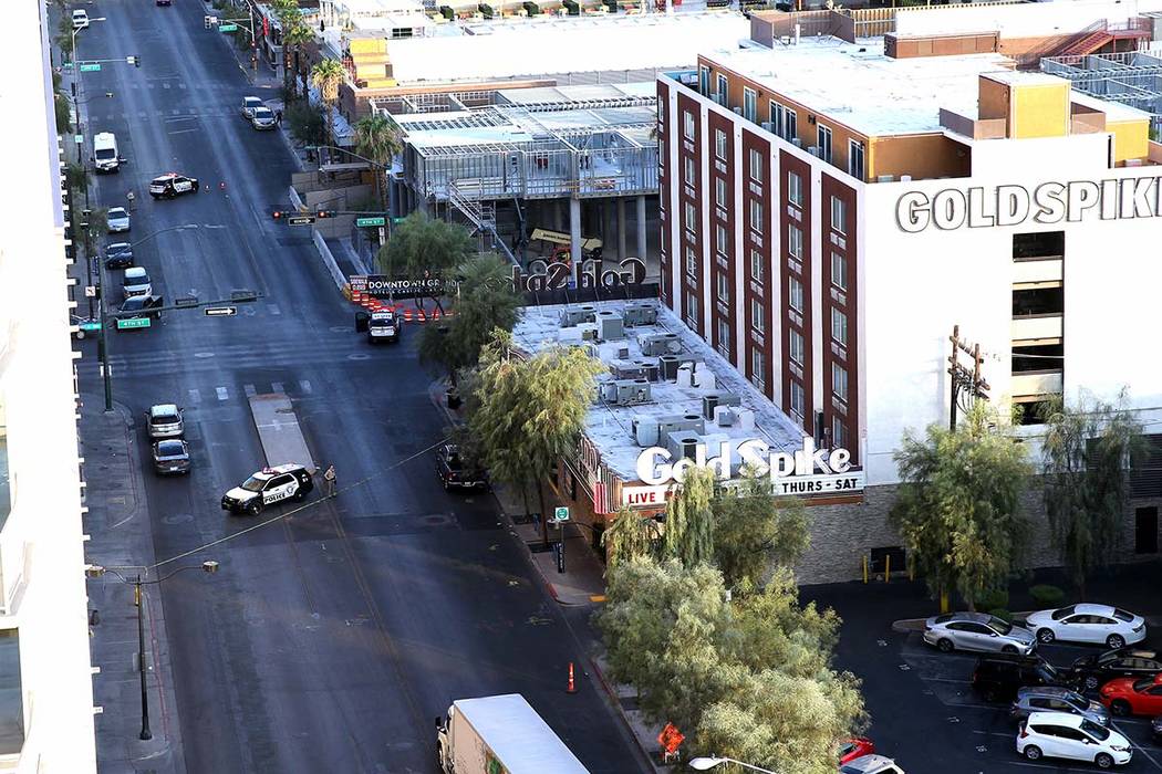 Police remain at 4th Street and Odgen Avenue in downtown Las Vegas, Thursday morning, Aug. 22, ...