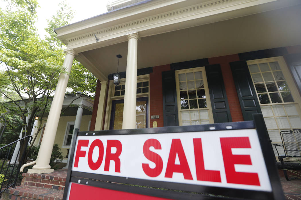 In an Aug. 16, 2019, file photo a for sale signs beckon buyers to homes along Park Avenue in Ri ...