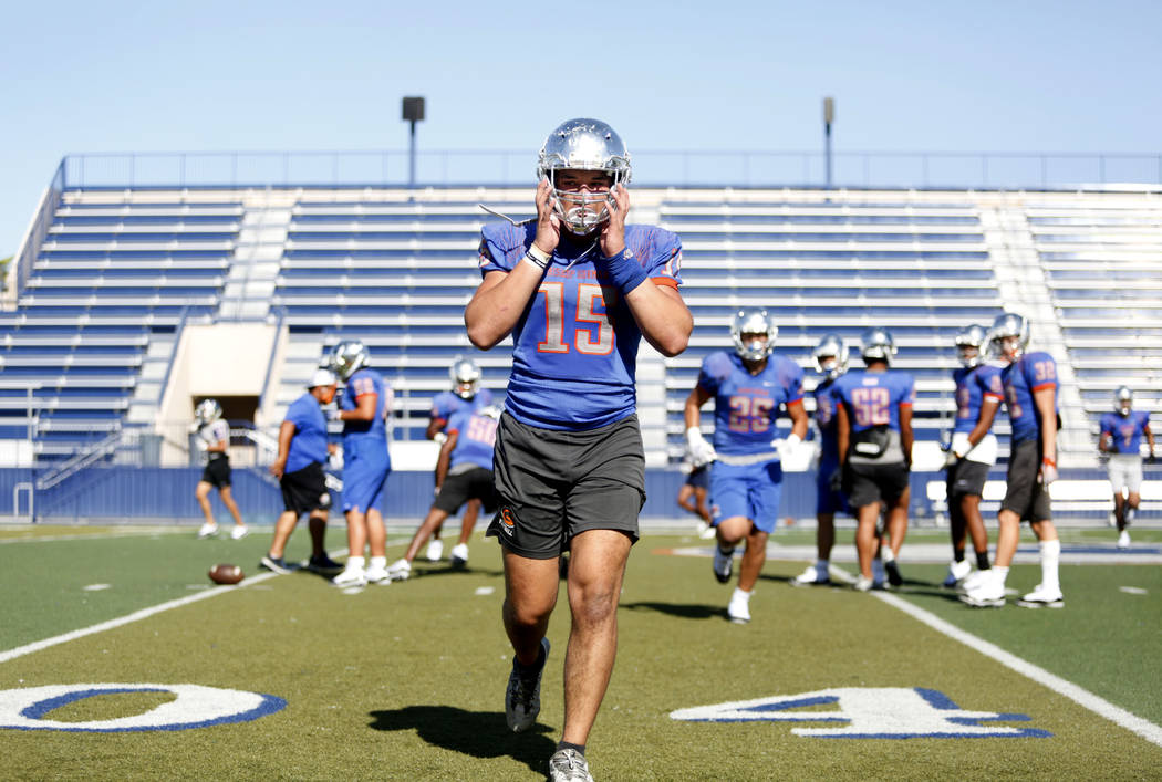 Bishop Gorman's outside linebacker Dahlin Mesake (15) completes a drill during practice at Bish ...