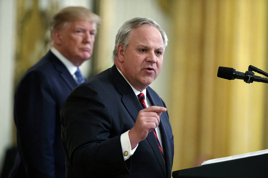 In this July 8, 2019 file photo President Donald Trump listens as Secretary of the Interior Dav ...