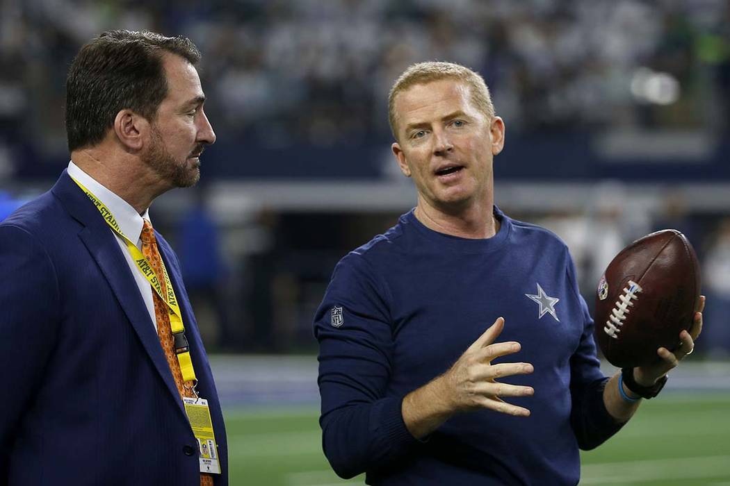 Broadcaster and former Dallas Cowboys quarter back Babe Laufenberg, left, and head coach Jason ...