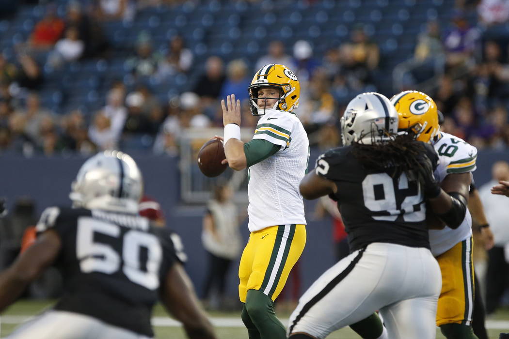 Green Bay Packers quarterback Tim Boyle looks for a receiver during the first half of an NFL pr ...