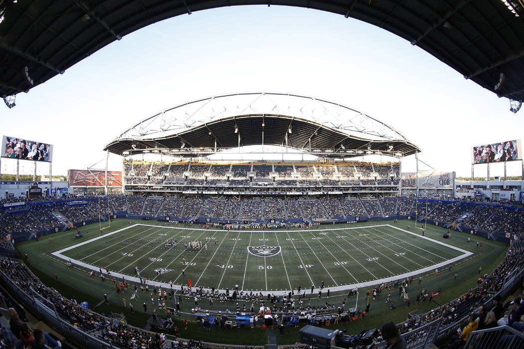 The Oakland Raiders and the Green Bay Packers play during the first half of an NFL preseason fo ...