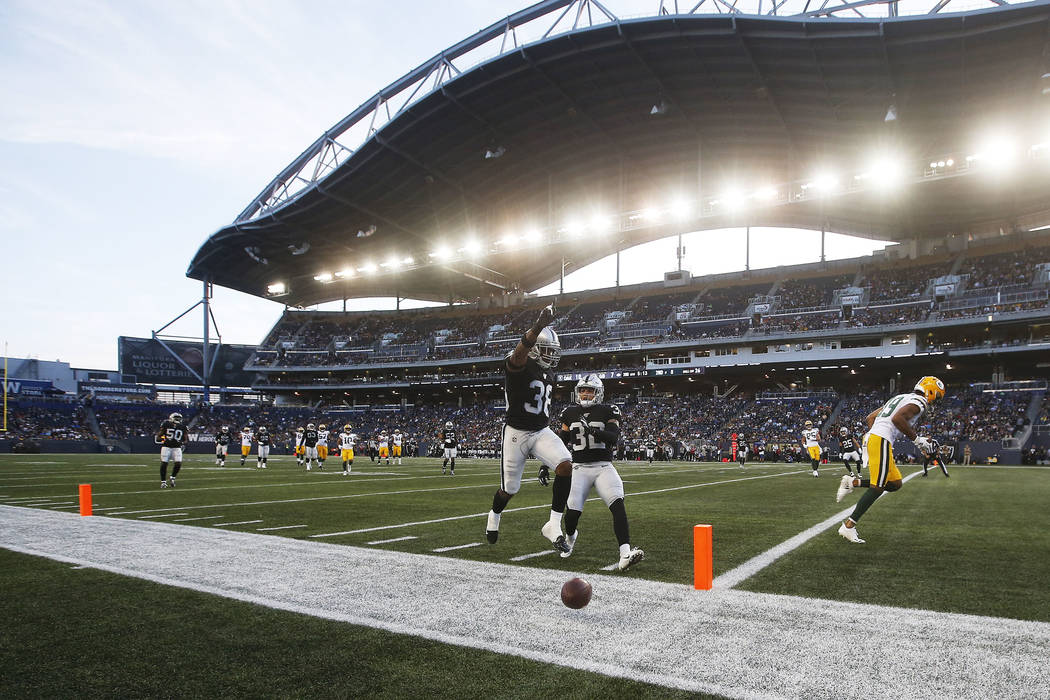 Oakland Raiders' Keisean Nixon (38) celebrates after knocking away a pass in the end zone inten ...