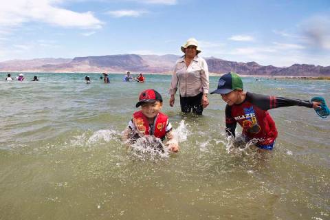 Jaiden Sanchez, 4, left, and his brother, Jason Sanchez, 7, splash in the water as their aunt N ...